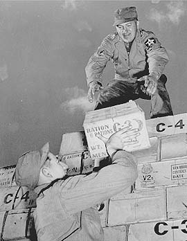 Loading C3 and C4 rations, Korea 1953. Courtesy of Olive drab