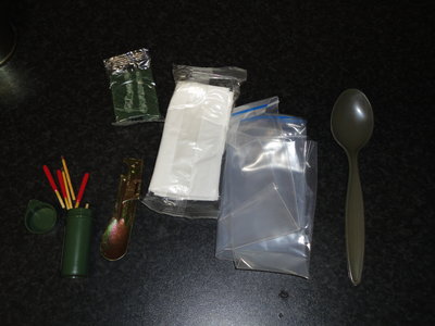 Some of the less edible items:<br />R to L <br />Matches in waterproof container<br />F.R.E.D.<br />Scourer with impregnated soap<br />Dunny paper two ply<br />Resealable Bag<br />Racing Spoon