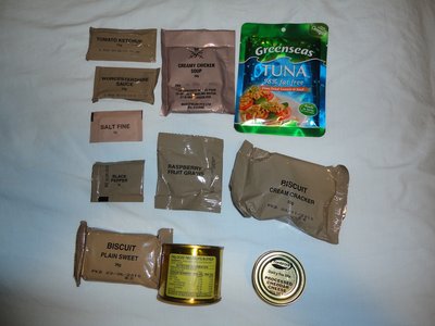 DSC00620.JPG (467.95 KiB) Viewed 7983 times Oven dried Tomatoes and Basil Tuna, creamy chicken soup, condiments, canned two fruits sweet and savoury biscuits, and the infamous canned cheese (reputed to be responisble for the scratch and bite marks on the backs of toilet doors in barracks :-(