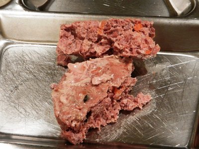 Juice removed, cut in half, it smells very good and you can see some carrots in there