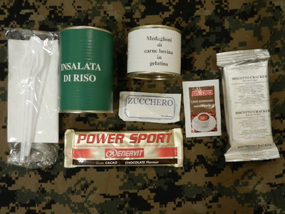 Rice Salad, Beef Medallions in Gelatin, Chocolate Energy Bar, Crackers, Coffee, Sugar and Plastic cutlery