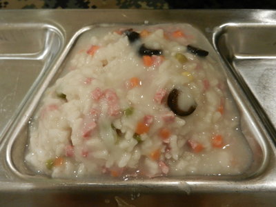 Carrots Peas Meat of some kind, and black olives