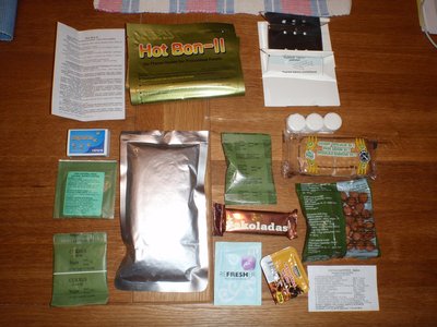 P4192143.JPG (206.35 KiB) Viewed 12911 times Stewed Chicken with Rice porridge, Special Crackers, Hazelnuts, Natural Honey, Instant Drink (Orange), Chocolate, Instant Coffee, Sugar, Moisturising Tissue, Matches, Moisturefree Fuel Tabletts, Canned Food Heater (Flameless Heater), Stove, Strap for package tightening (whatever has to be tighten in a ration...), a Note with instructions and content