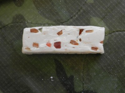 Looks like torrone with bits of jellied fruit