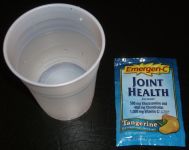 Emergen-C vitamin drink mix in water before